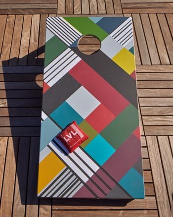A colorful abstract design on a wooden board.
